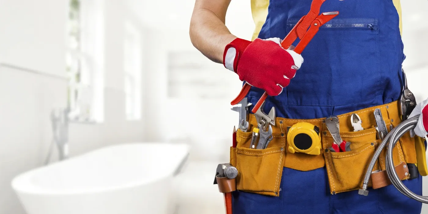 The torso of plumbing technician showing a tool belt from The Leander Plumber - Company in Leander, TX - Commercial plumbing services The torso of plumbing technician showing a tool belt from The Leander Plumber - Company in Leander, TX - Commercial plumbing services
